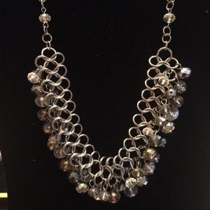 Silver necklace light topaz color stone and clear.